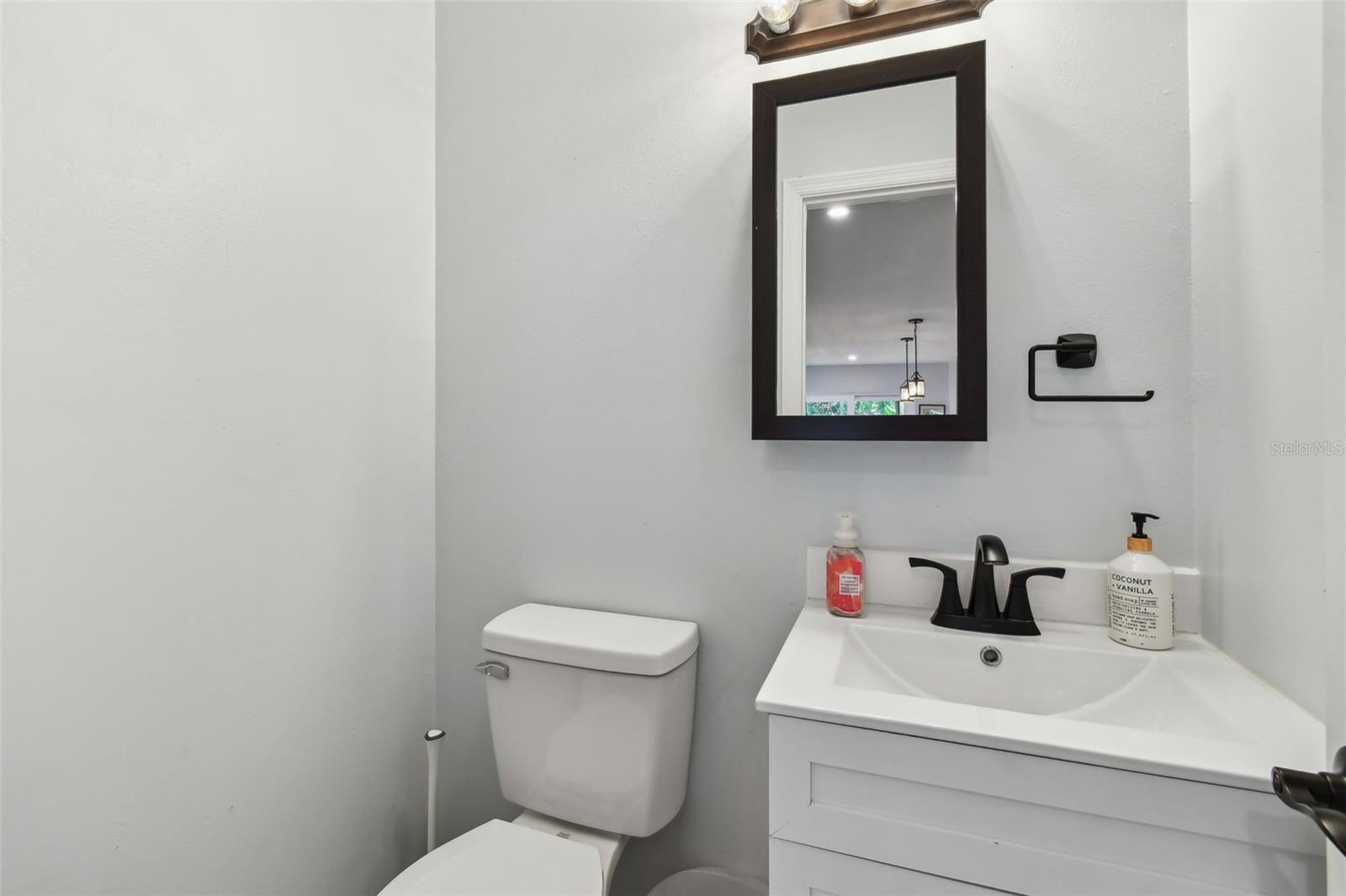 A powder room off the kitchen/living room area.