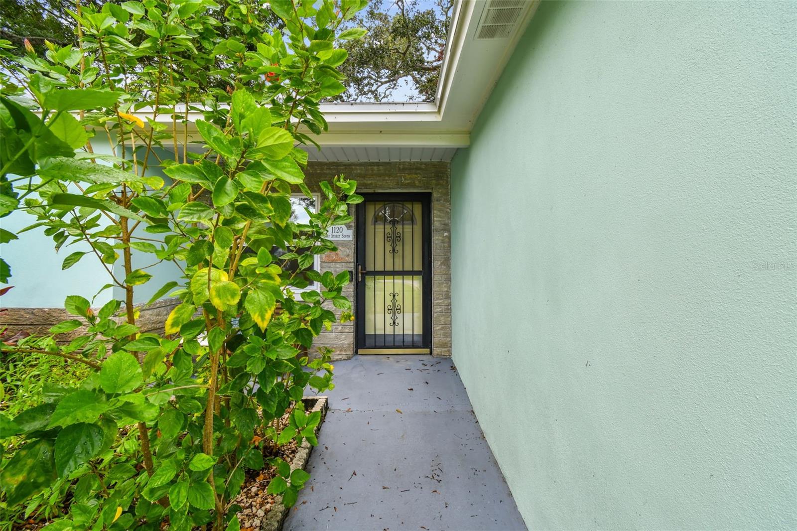 Lush landscaping envelops this property and adds privacy.
