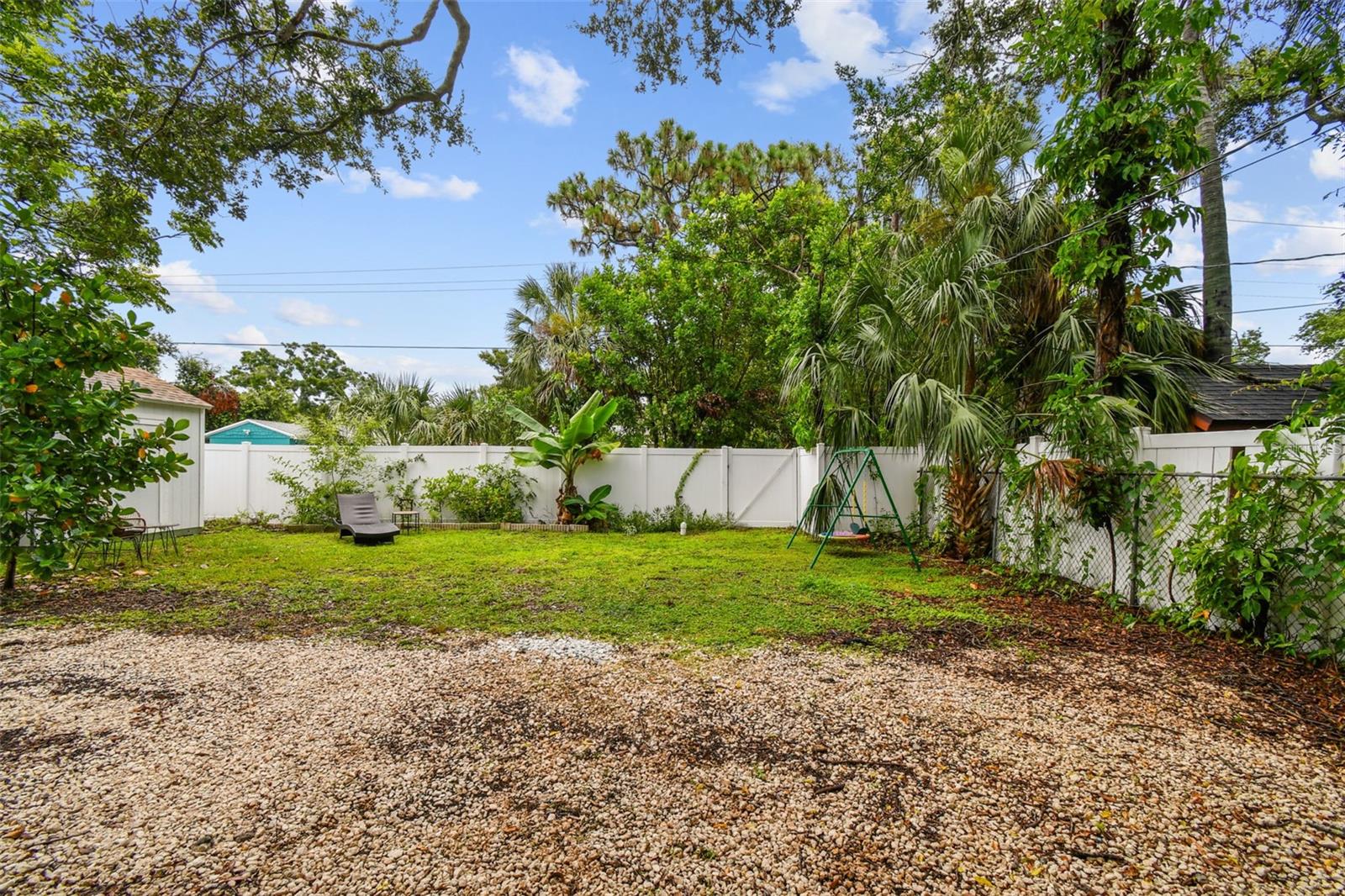 Large fenced backyard, with gated access to alley. Plenty of room for play equipment, a garden or a pool!