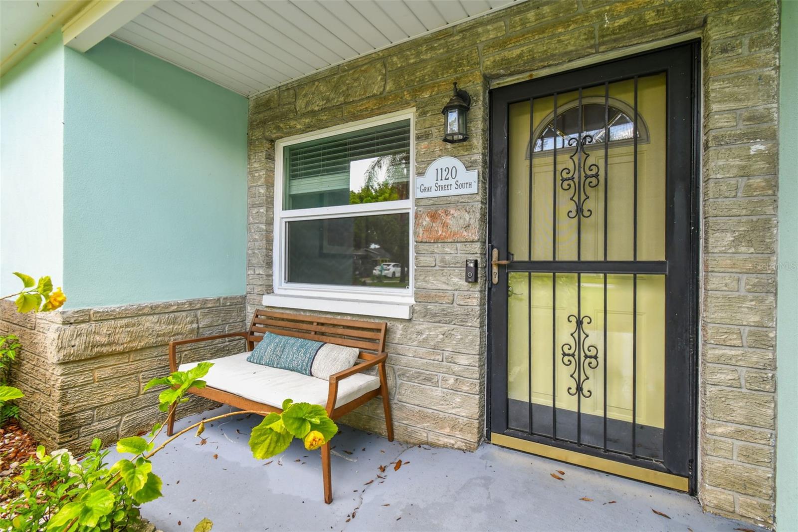 A lovely covered porch to greet your guests.