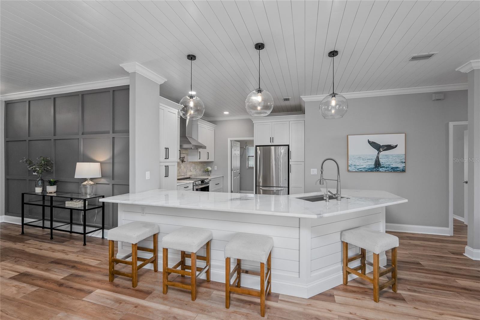 Marble countertops and wood accents throughout give this home a designer feel