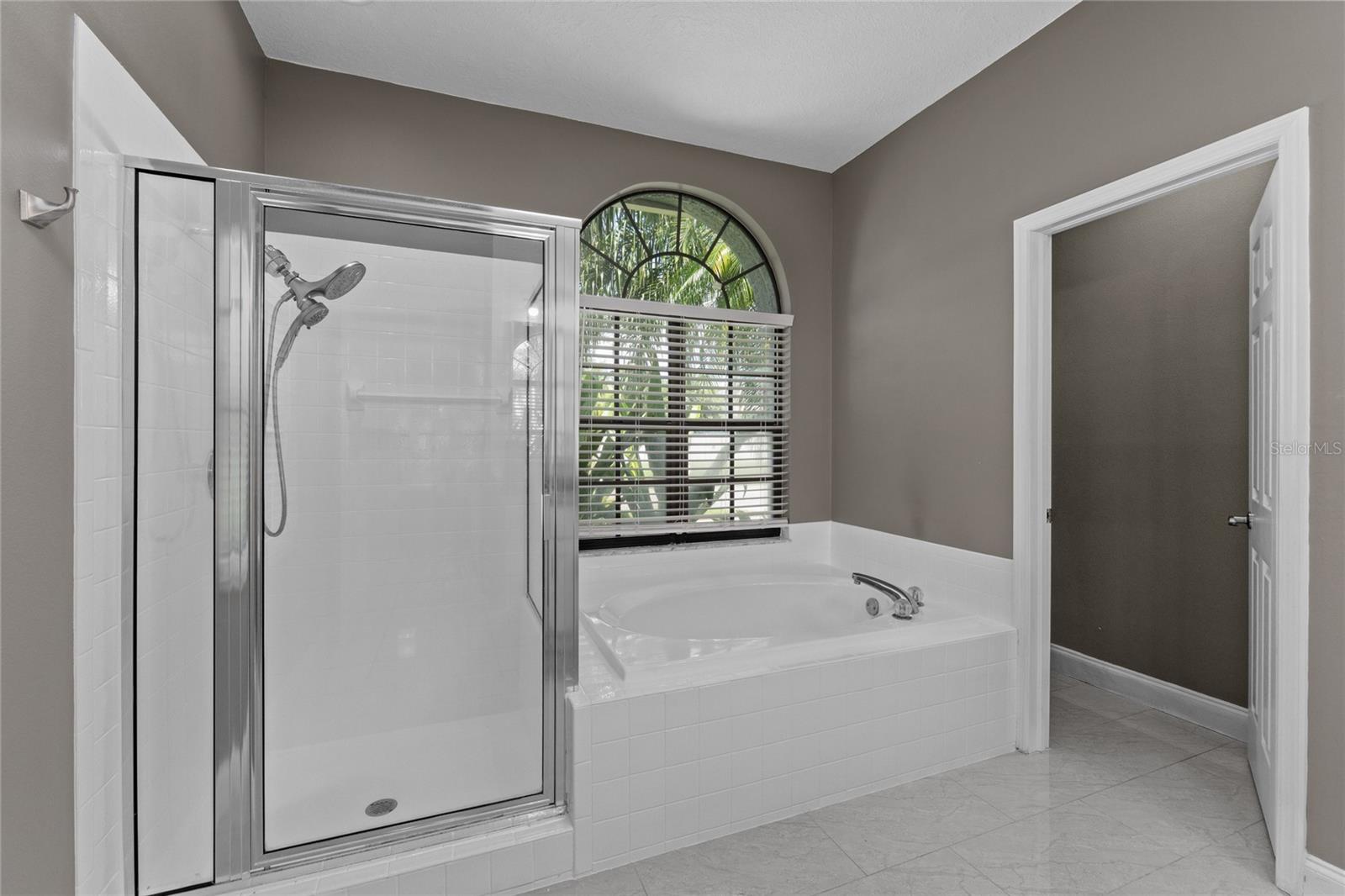 Primary Bathroom with tub and shower