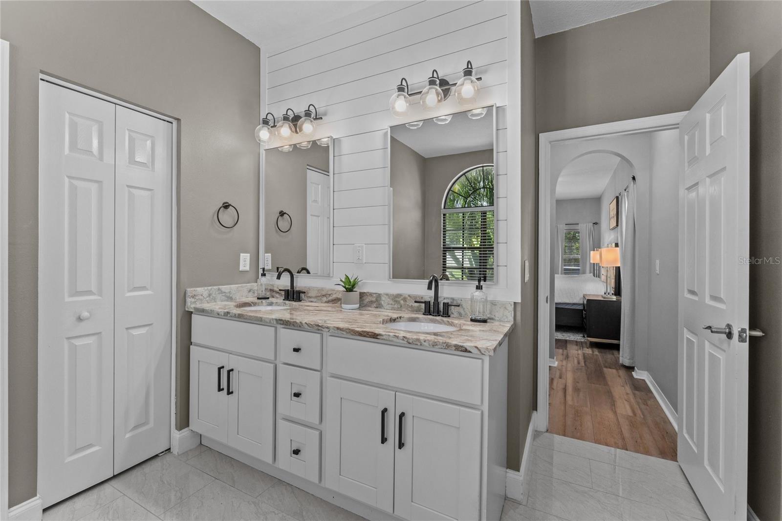 Primary Bathroom updated with granite countertops