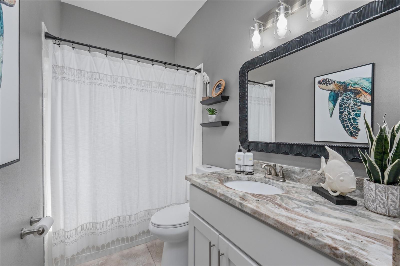 Bathroom 2 updated with granite countertop, new lighting and fixtures
