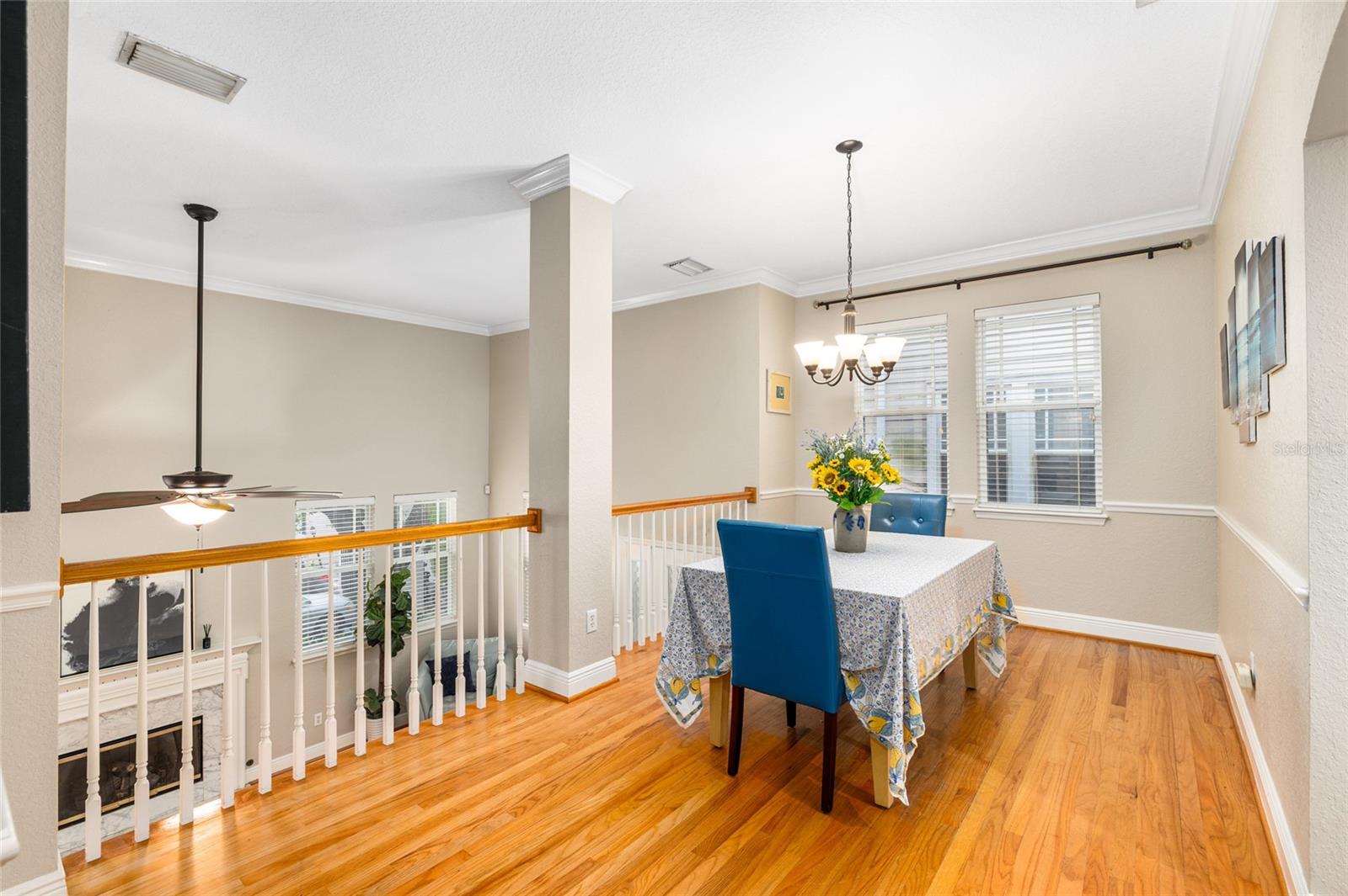 Gleaming hardwood floors overlooking the living room and fireplace