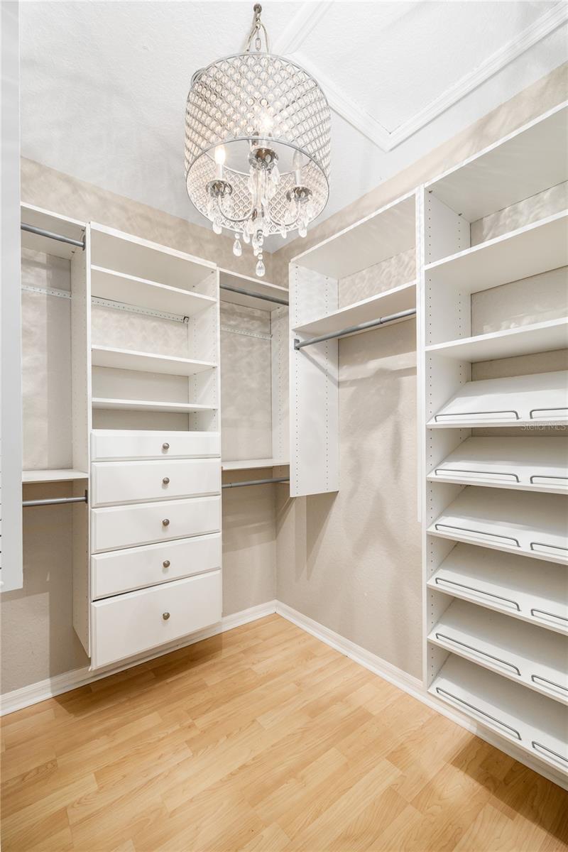 Perfectly appointed primary walk-in closet