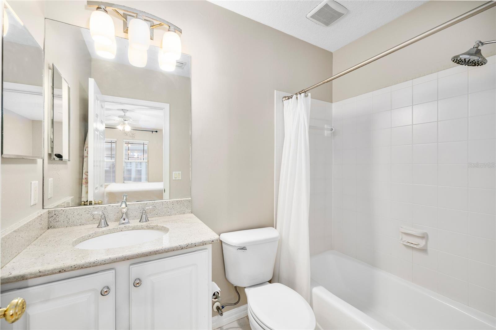 The attached full bath has a tub/shower combo