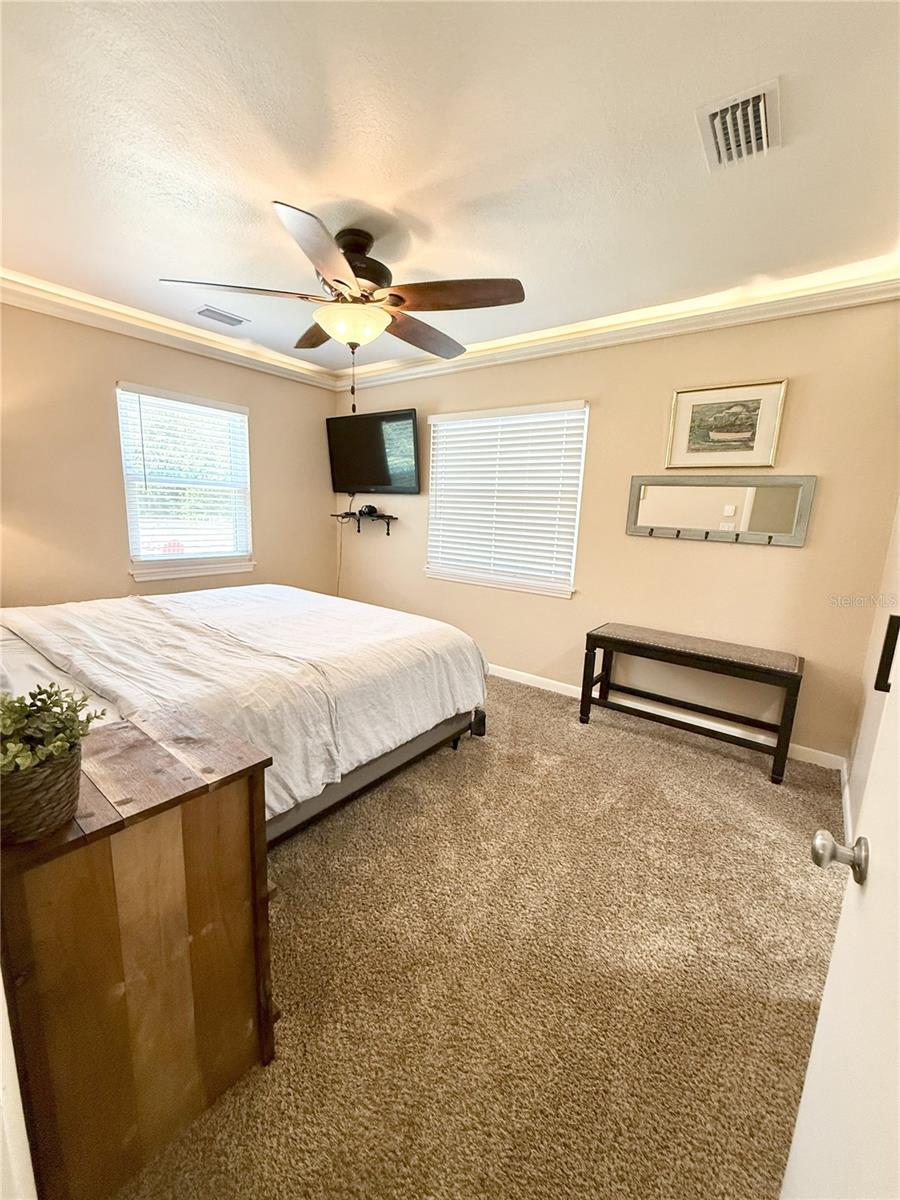 Primary Bed w/tray lighting and walk-in closet