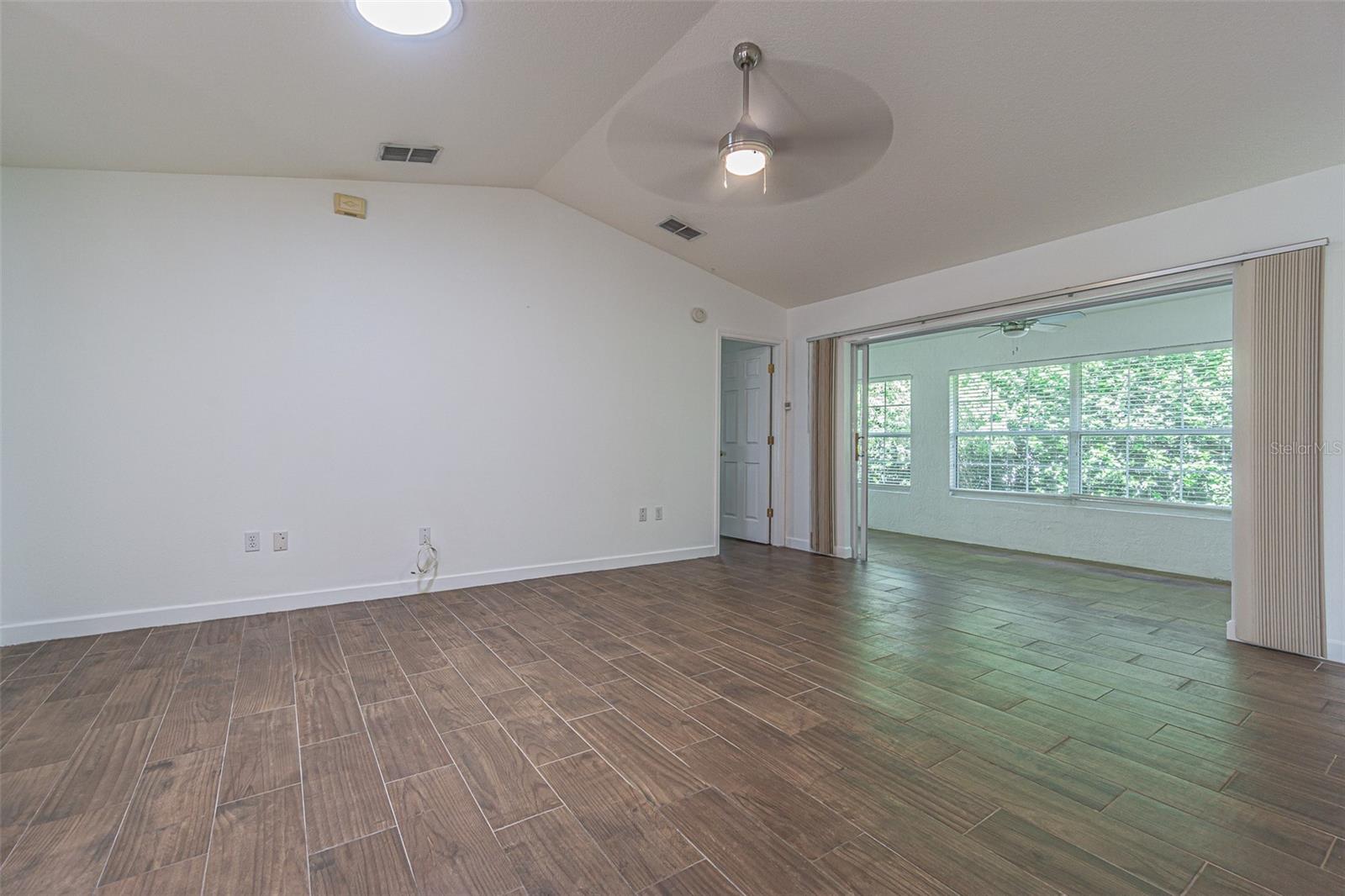 Great room opens to Enclosed Florida room for easy entertaining!