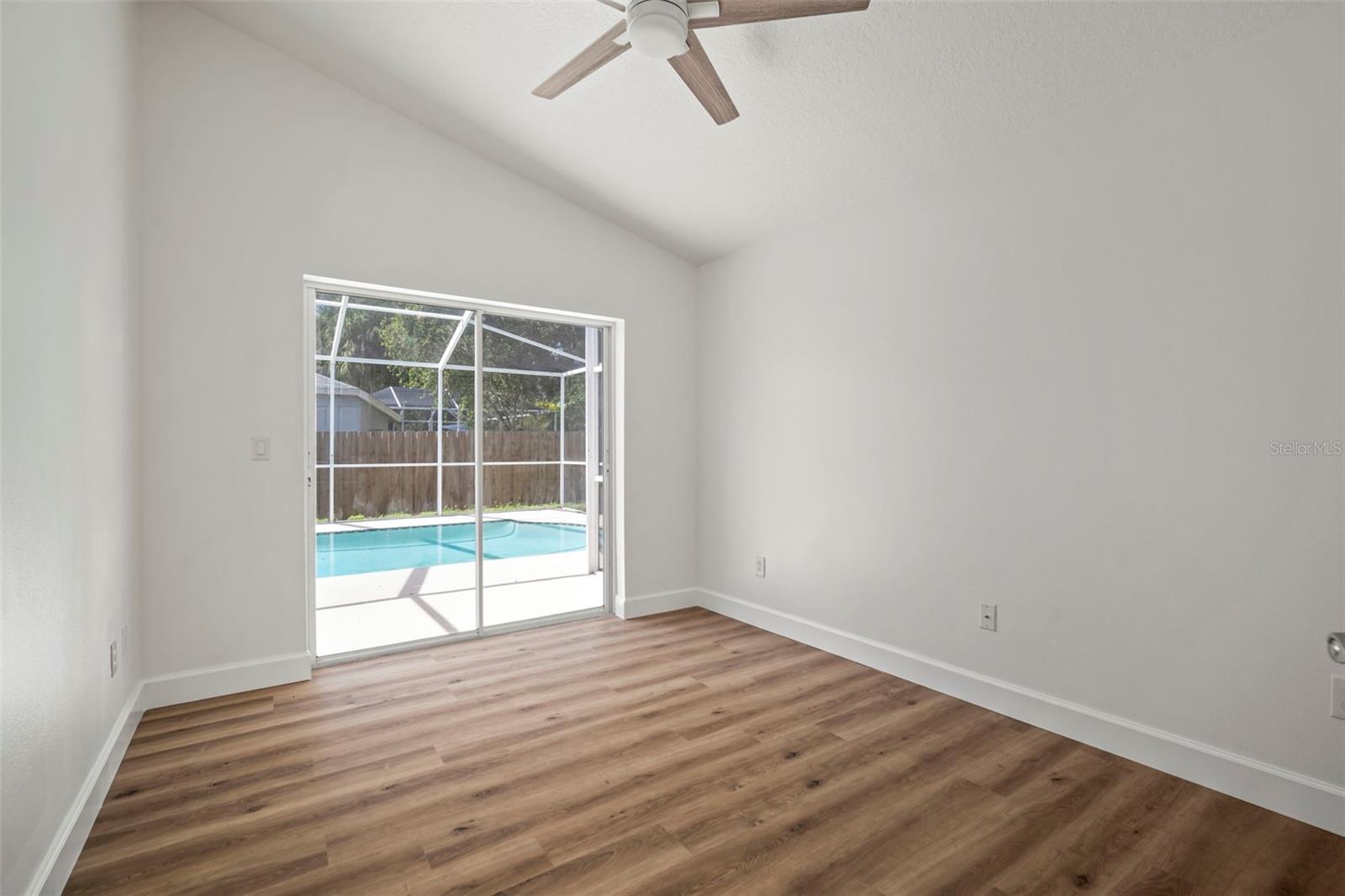 Bedroom 4 with slider access to pool