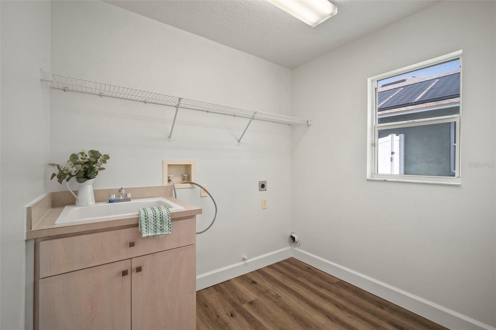 Laundry room with mud sink