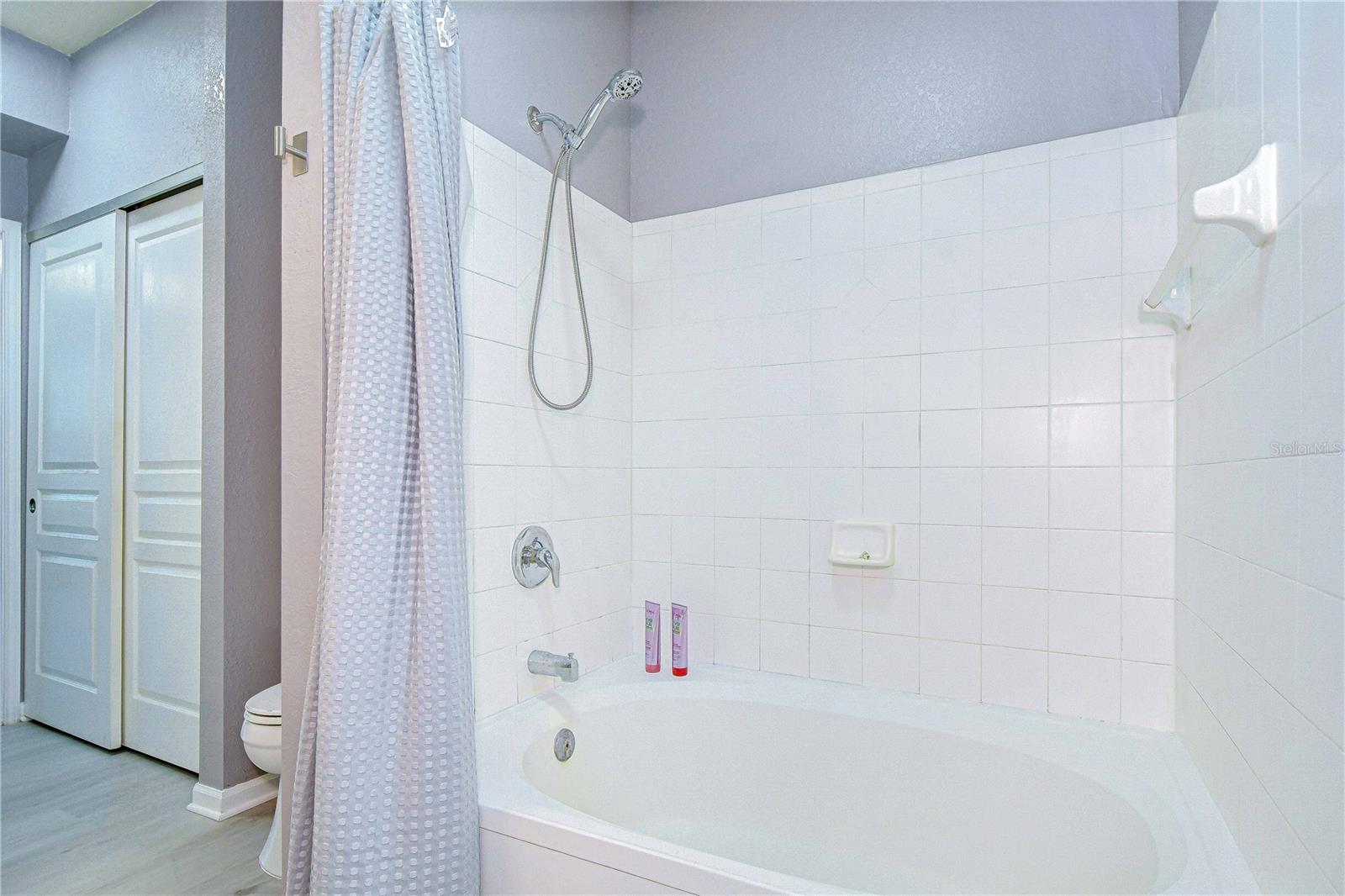 Second bathroom with a large tub/shower.
