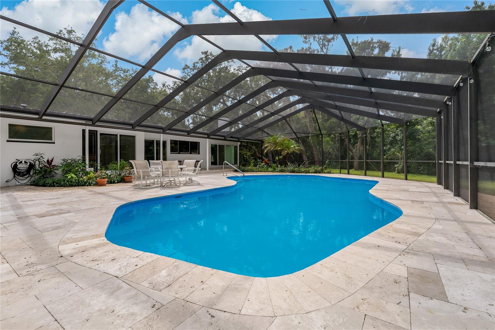 You will love this Spacious, Screened in Pool and Covered Lanai Space!