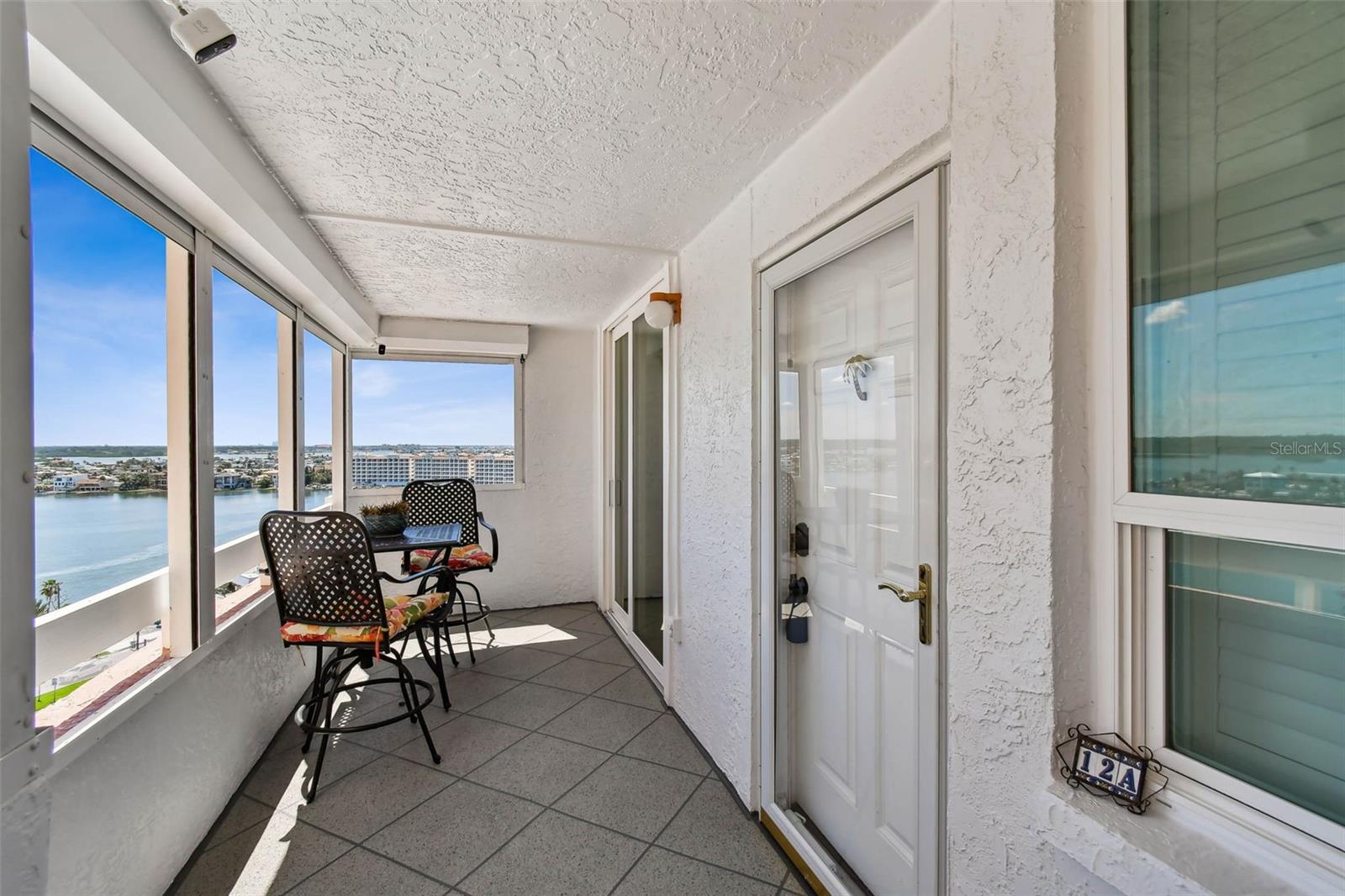 Private entry with balcony and gate