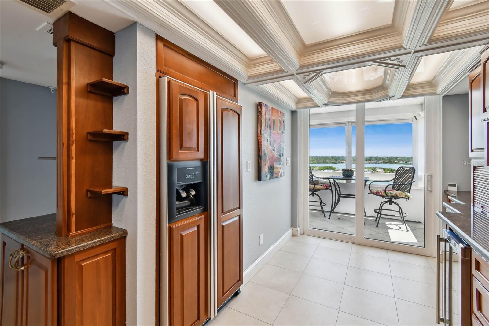 Sliding doors off of the kitchen to private front balcony