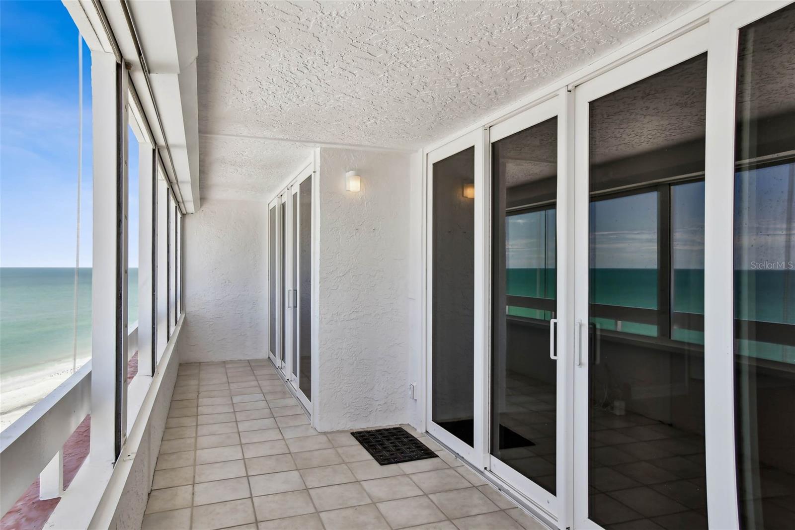 A wraparound balcony with views of the beach