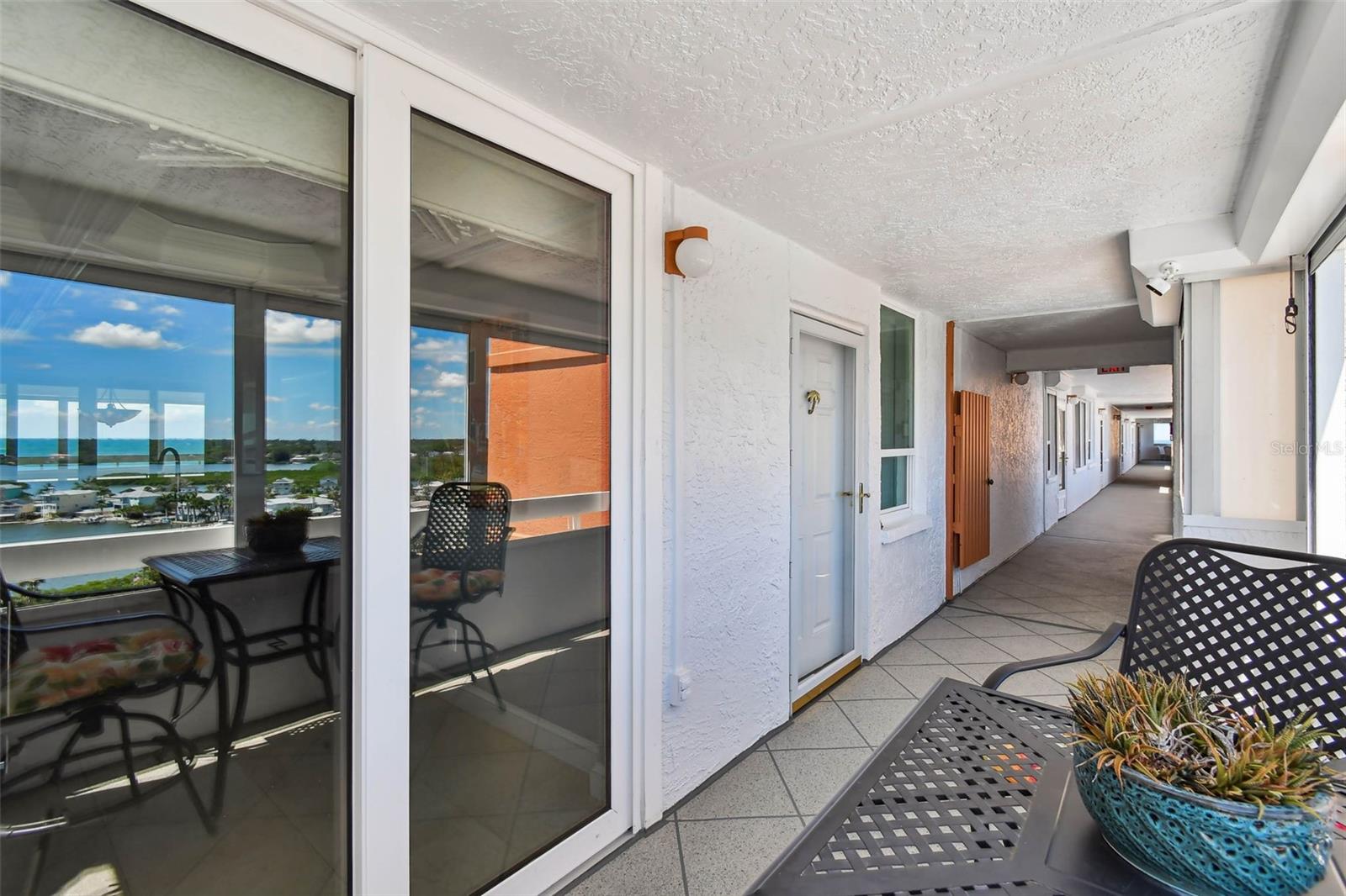 Front door and sliders out to balcony