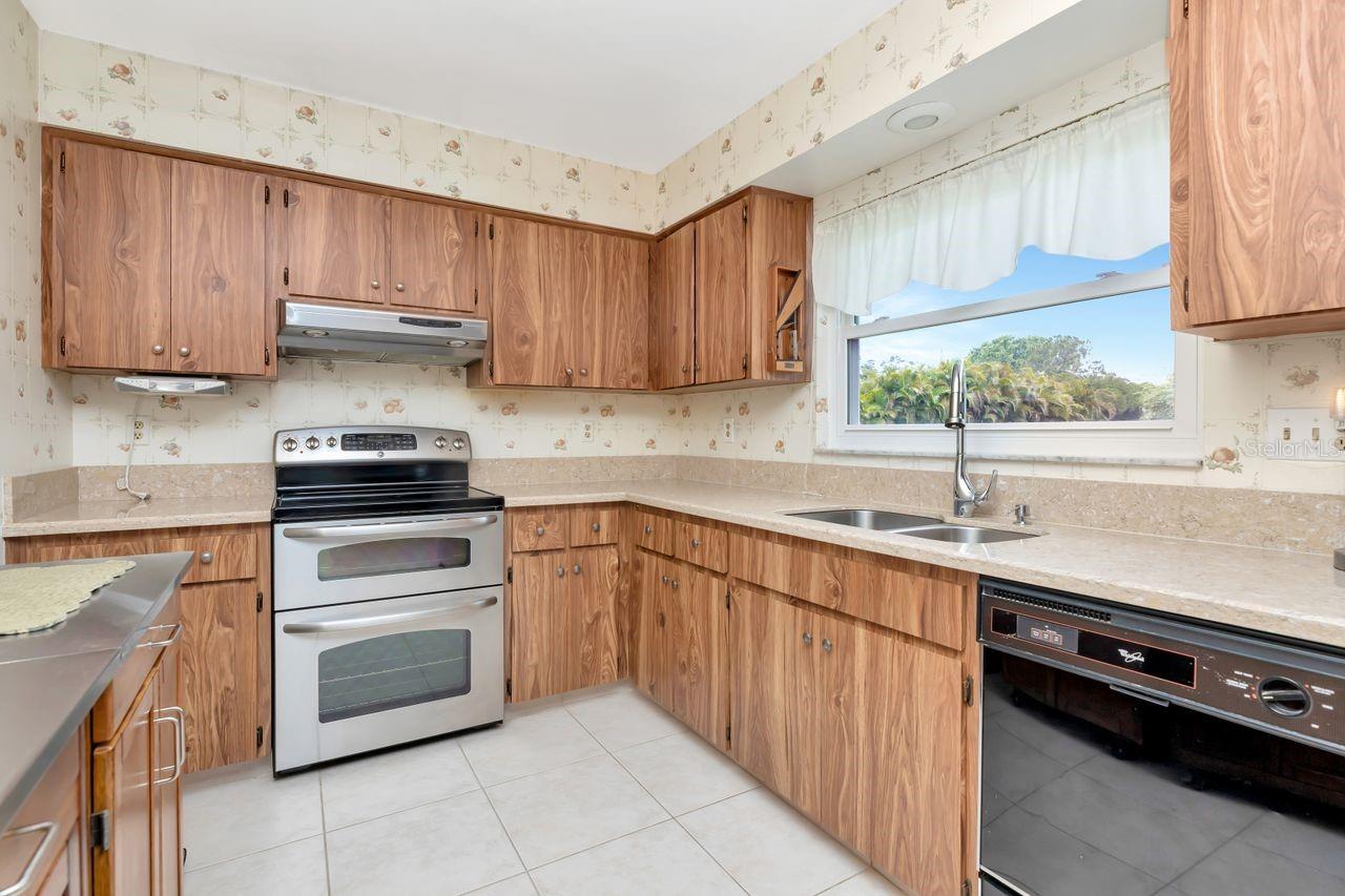 Kitchen with newer quartz countertops.