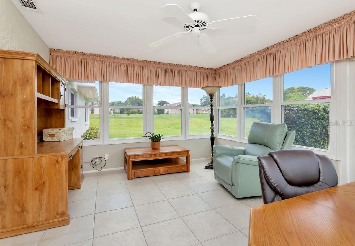 The view from the Florida room is a lot of green areas.