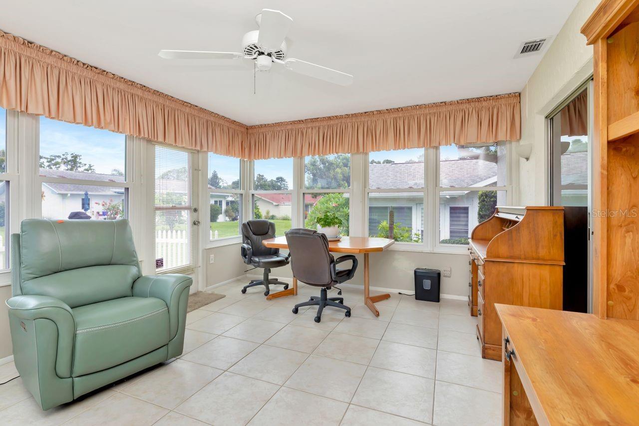 Although this property is in a very active 55+ community, this home has a generous amount of space around it so there's a feeling of privacy as you enjoy being in the Florida room.