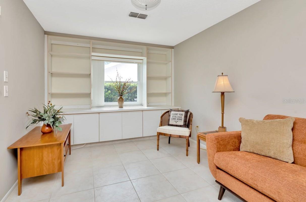 Even the den with built-in cabinets is spacious.