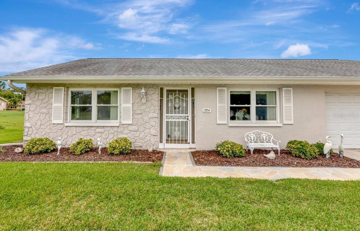 This beautiful home beckons you to step inside.