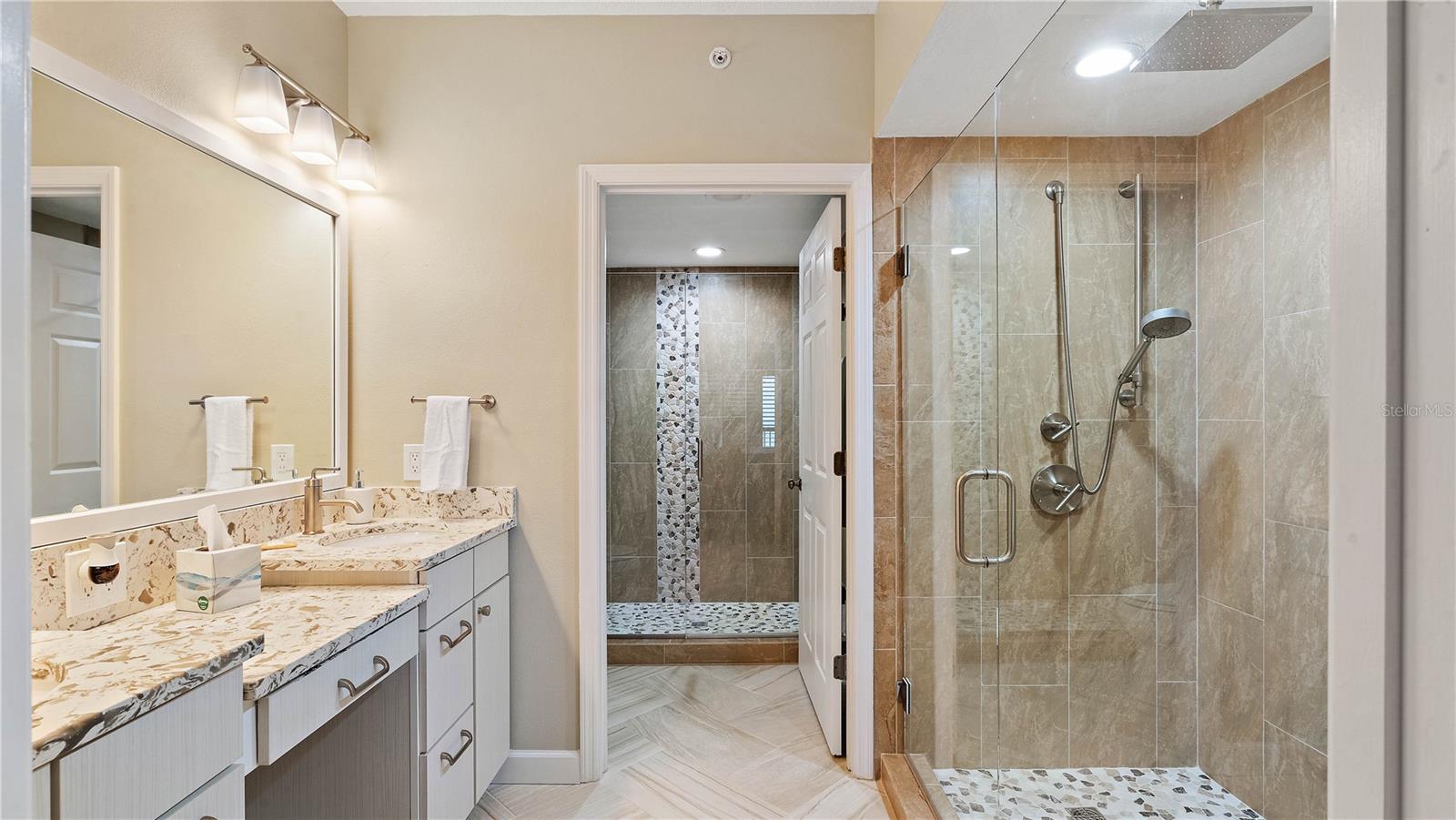 Dual walk in showers in the primary bathroom
