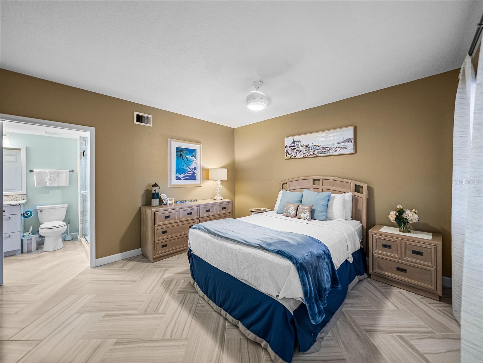 Access the guest bathroom easily from this generous bedroom