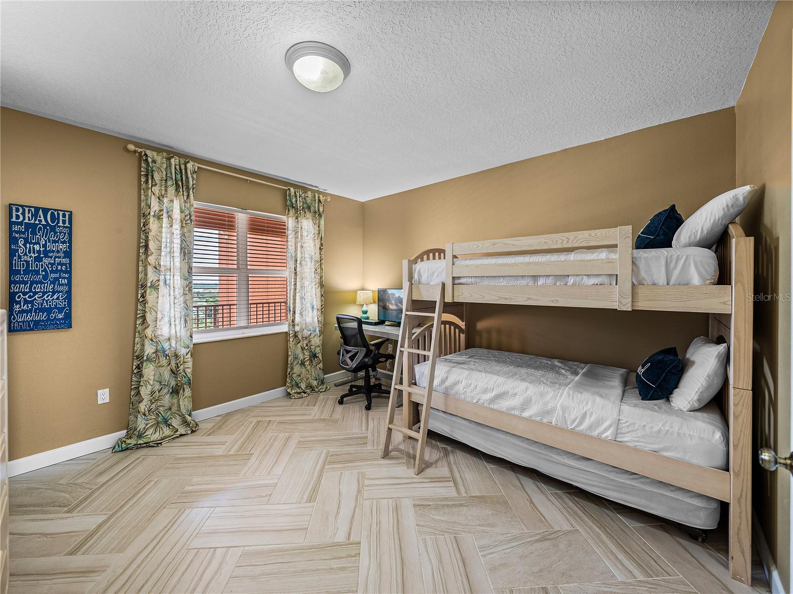 Second guest room is complete with a walk in closet and access to hall bath.