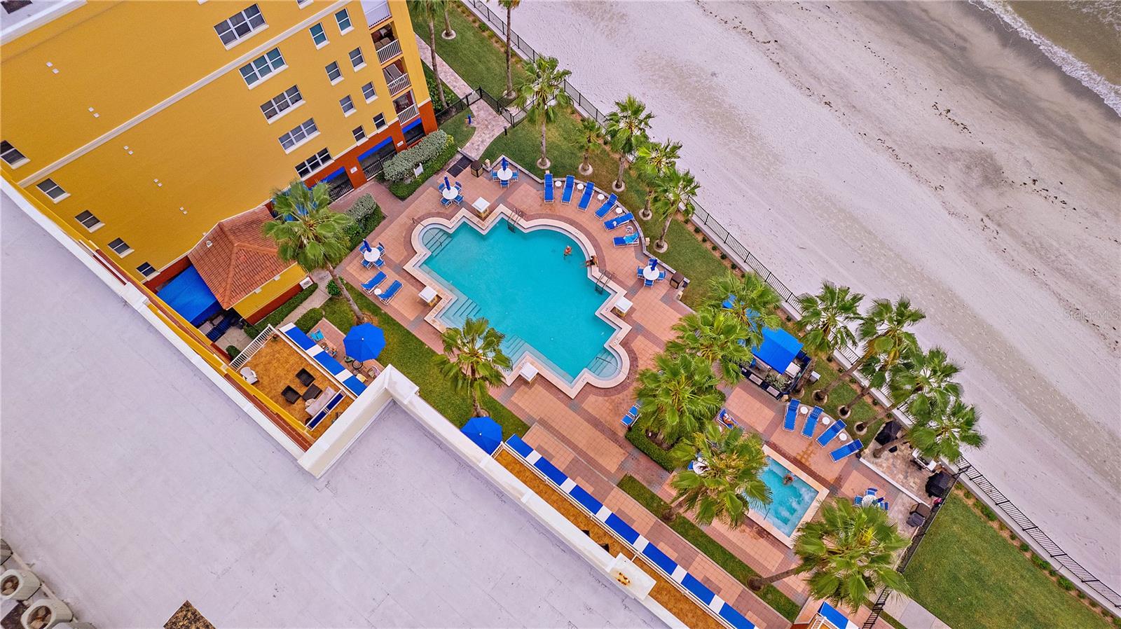 Looking down from your balcony at the second community pool - Before repairs