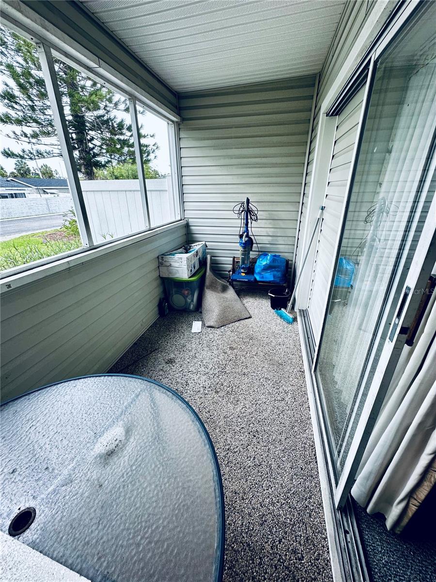 Screened-In Patio with Sliding Door to Living Room and Door to Bedroom 3/Den/Office
