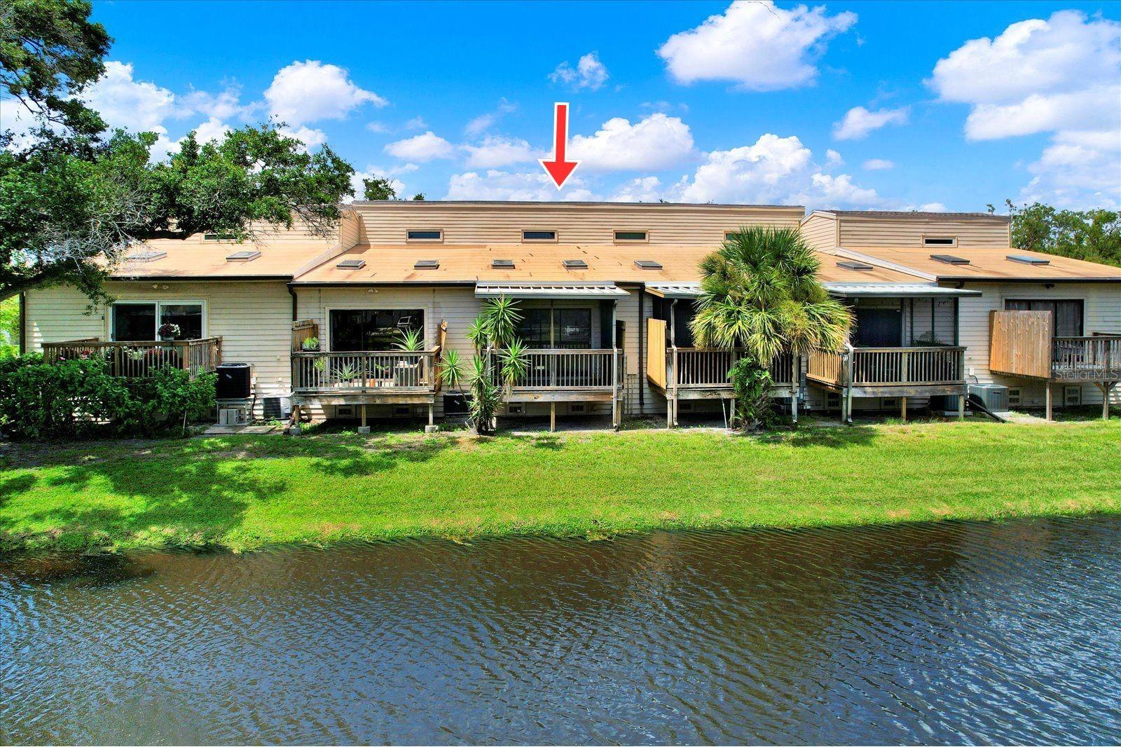 Waterfront /pond view from the living room and private screened patio.