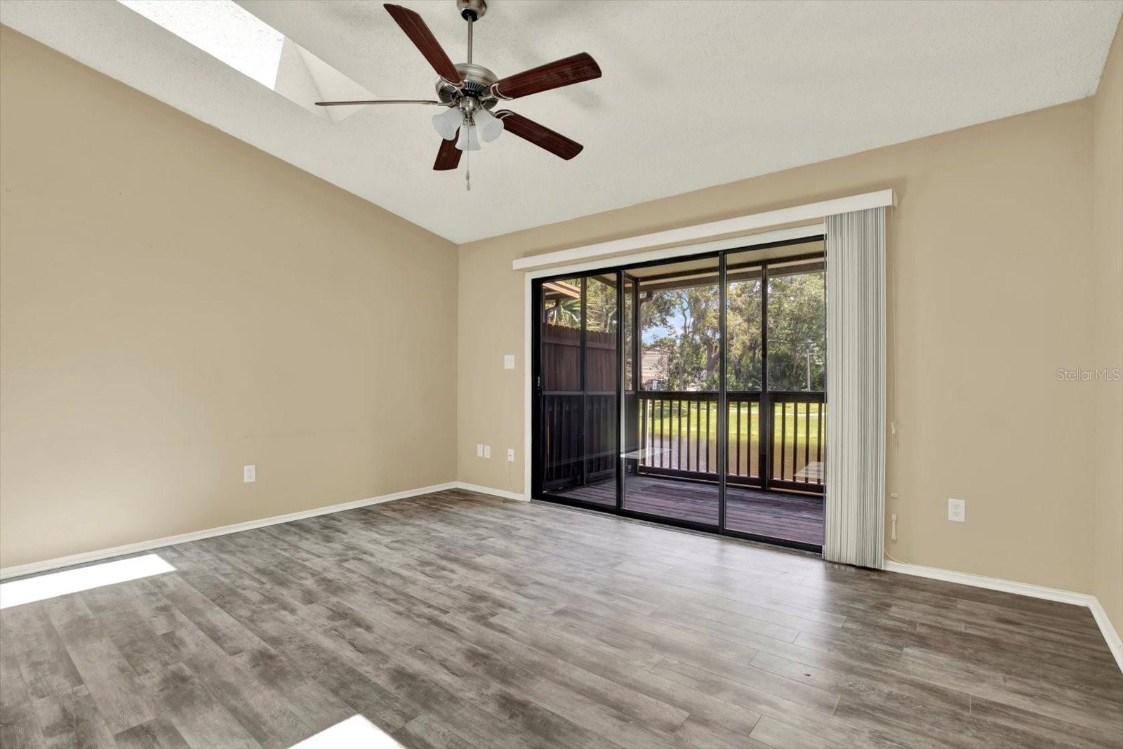Living room/patio with plenty of natural lighting from skylights.