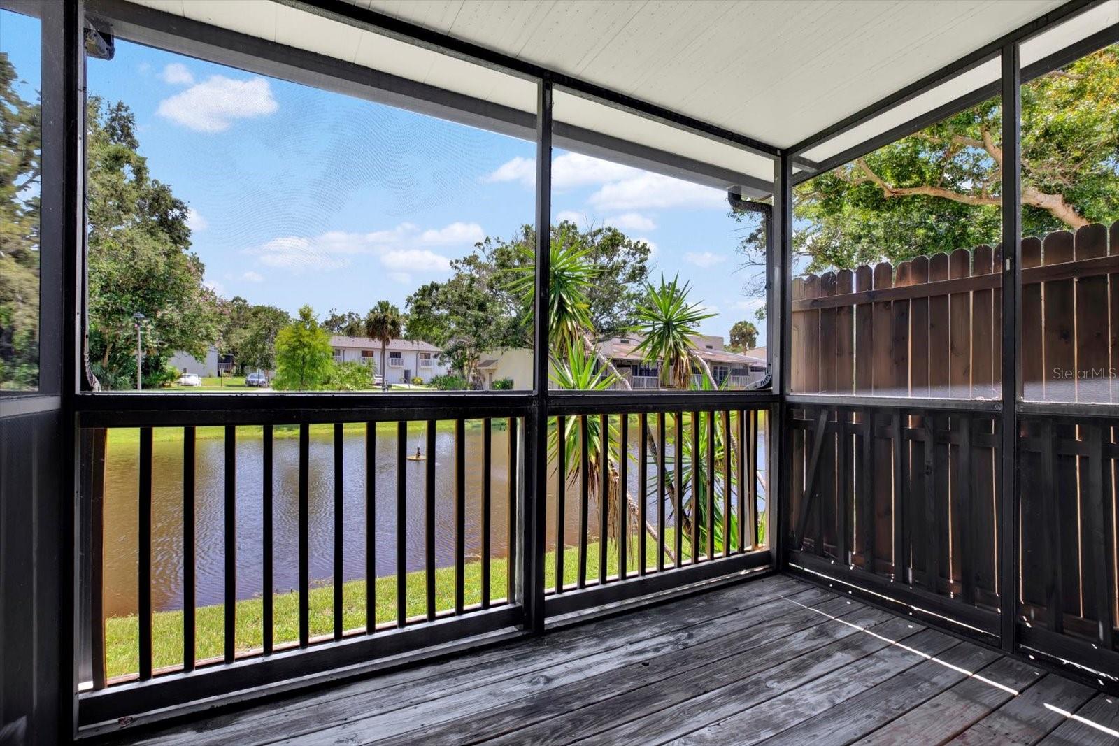 Large screened patio with pond/water / fountain view