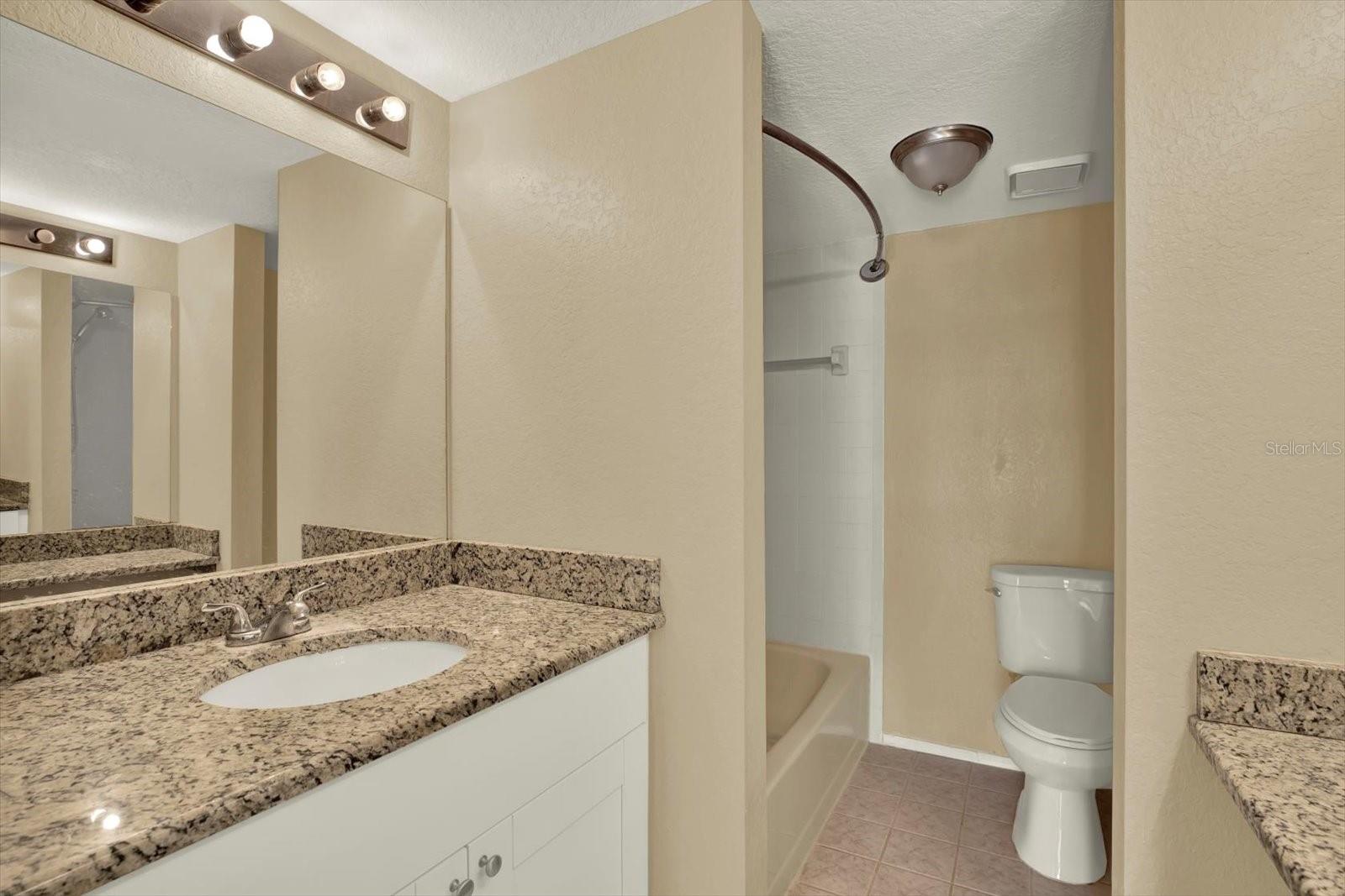 Primary ensuite, dual granite  counters shower/tub combo