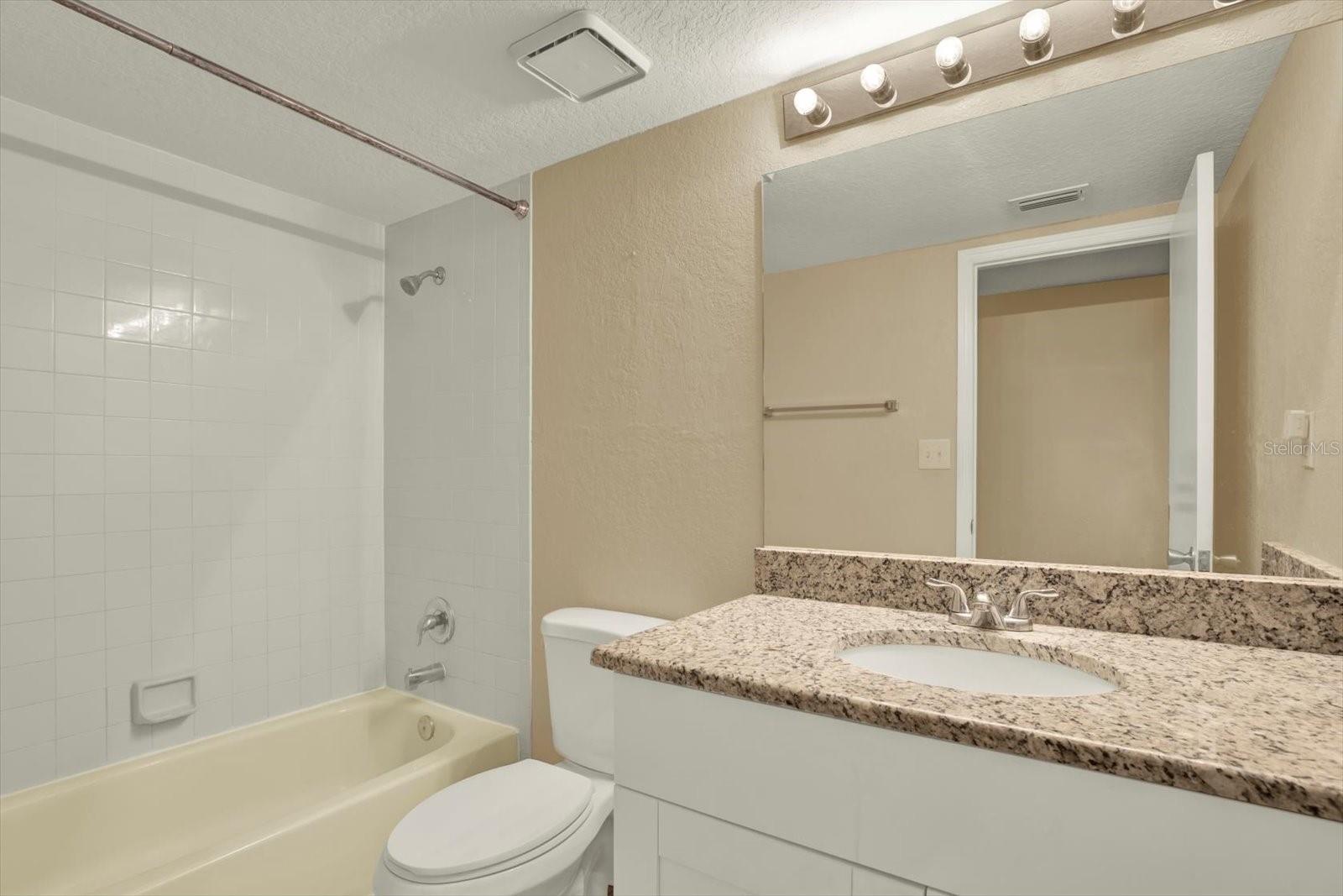 Guest bathroom with granite counters