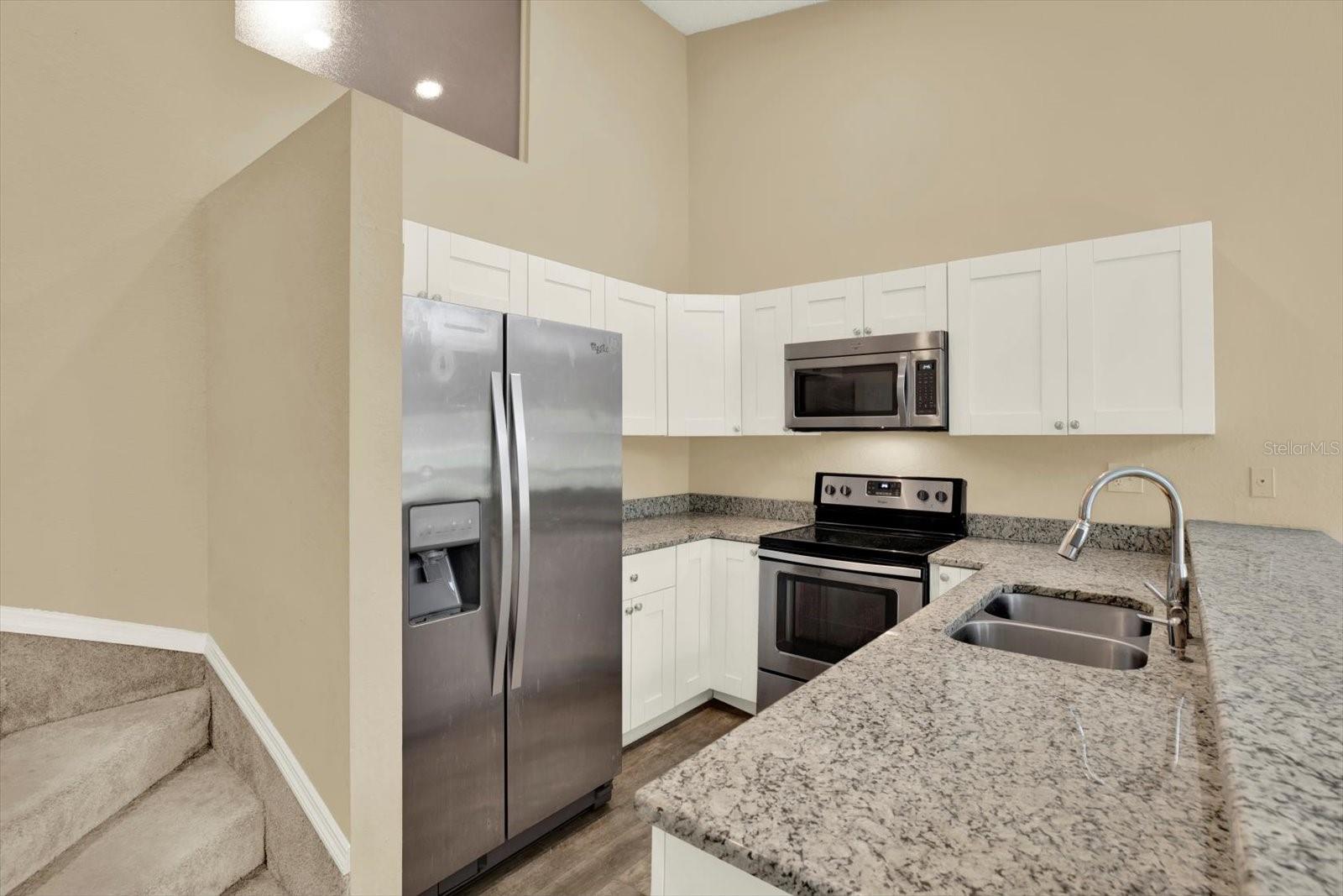 Second level updated kitchen, stainless steel appliances, granite countertops.
