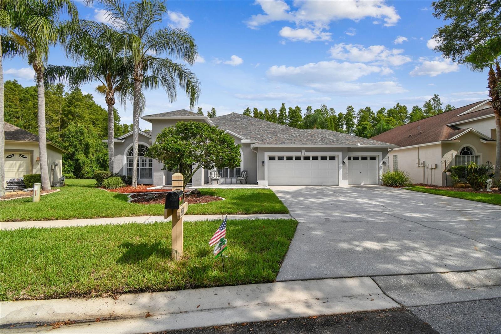 Front Exterior W/3-Car Garage & Driveway
