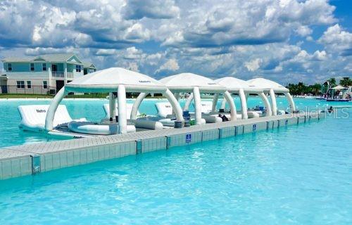 Enjoy all the Lagoon has to offer! Relax on the beach, swim in the clear, blue water, and enjoy the adventure with access to the water slide, water obstacle course, bumper boats, kayaks and paddle boards.