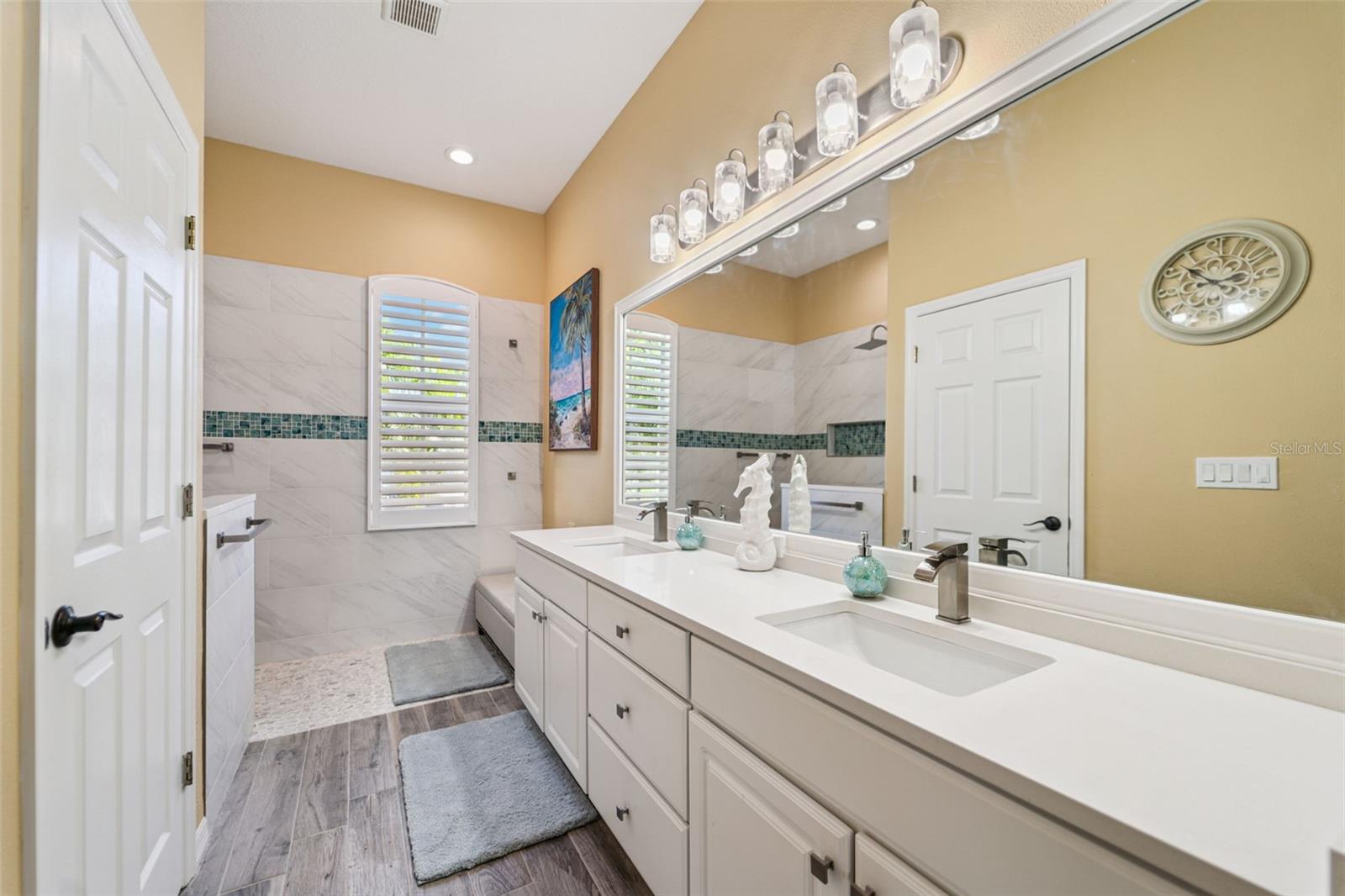 Fully updated primary bath - dual vanity, walk-in shower, plus *bonus* hidden plumbing for easy addition of a soaking tub.