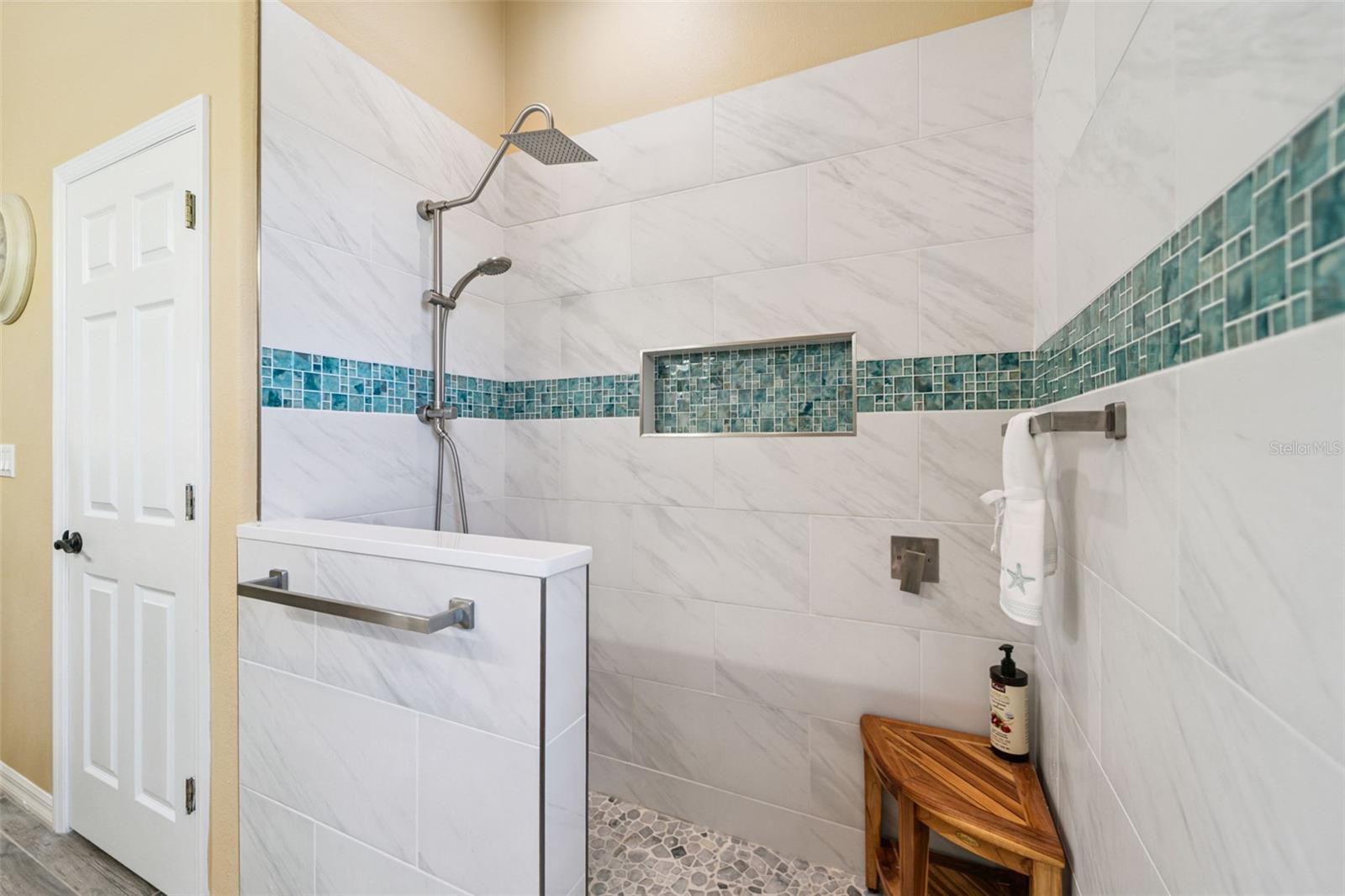Fully tiled walk in shower.