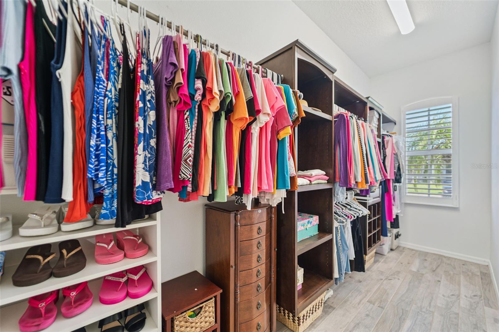Large walk-in closet with built in features to maximize space