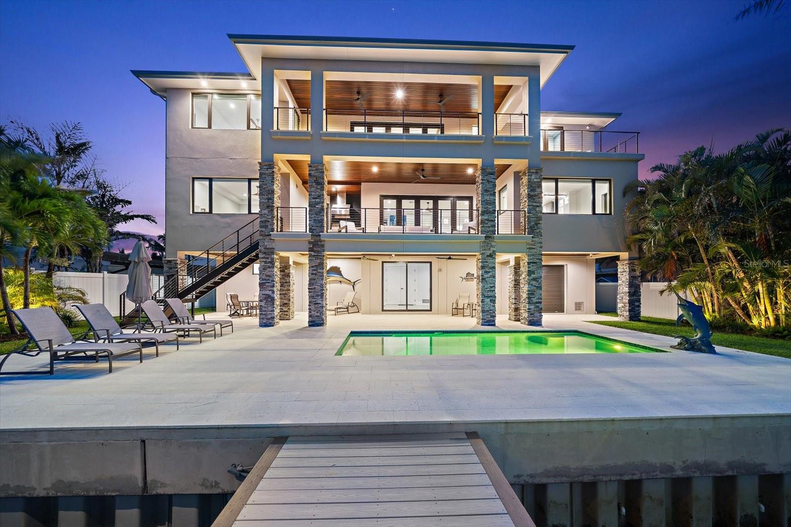 Concrete block construction, and attractive metal roof system. Expansive living spaces complemented by sweeping terraces and panoramic water views.