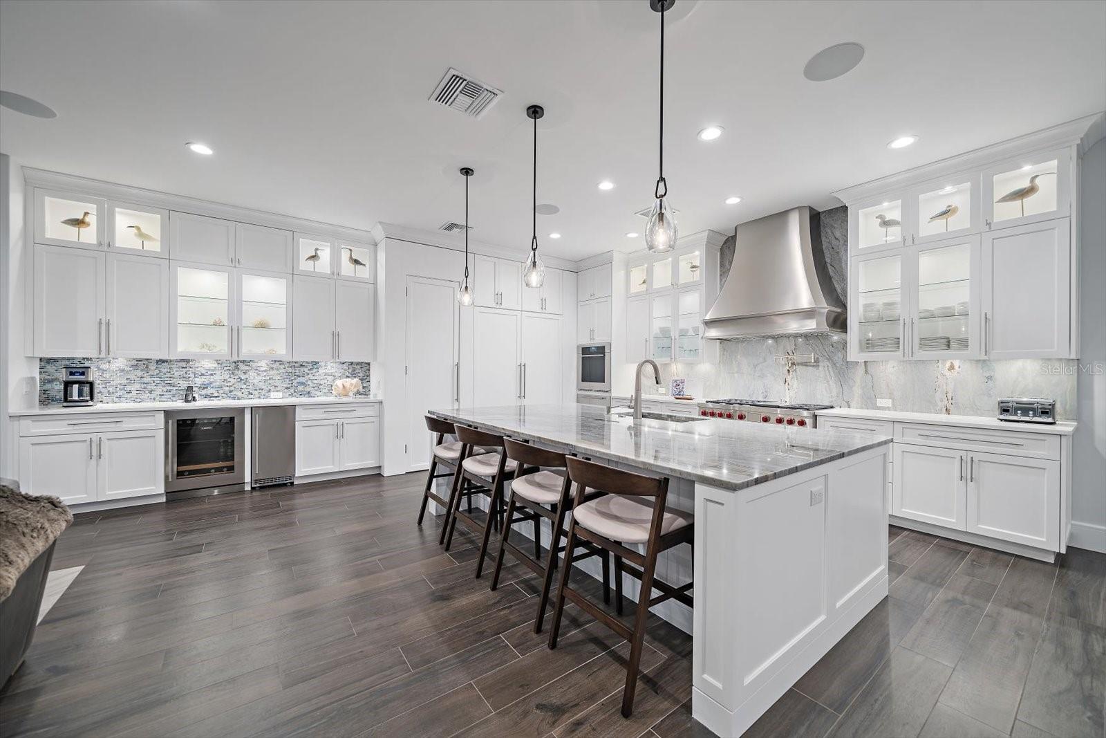 Spacious breakfast bar, exquisite lighting, gleaming granite, Wolfe and Sub Zero appliances