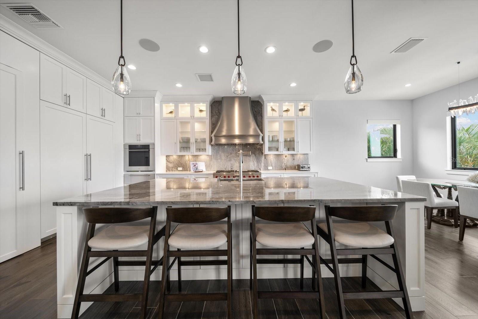 Lutron lighting system contributes to the ambiance of this show stopper kitchen.