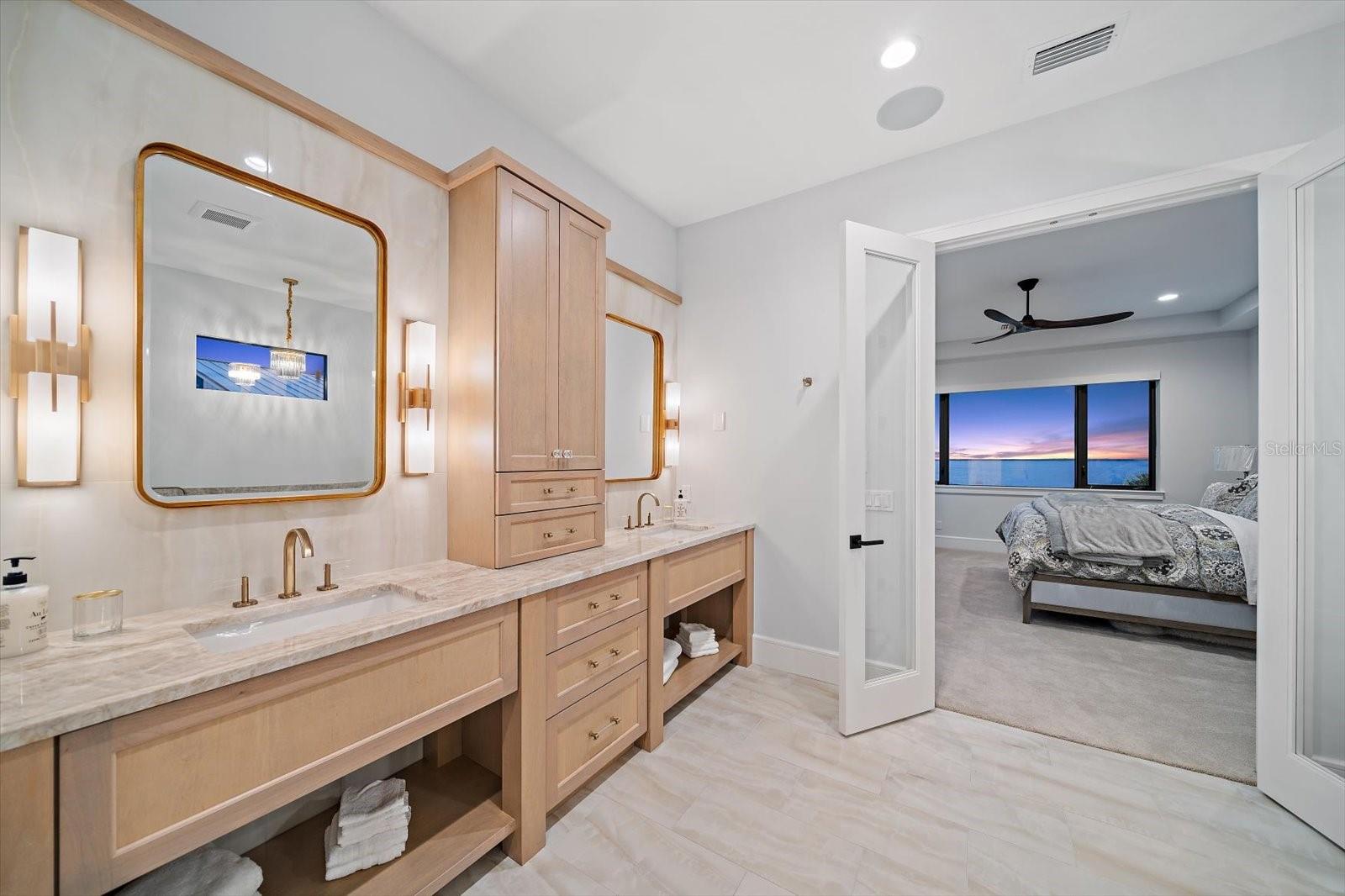 Primary bath area with fabulous vanity area bathed in natural light.