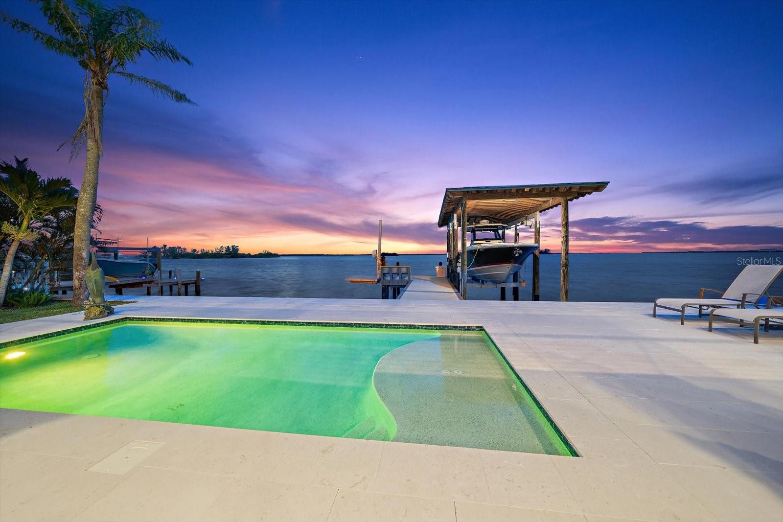 Saltwater pool with natural stone decking