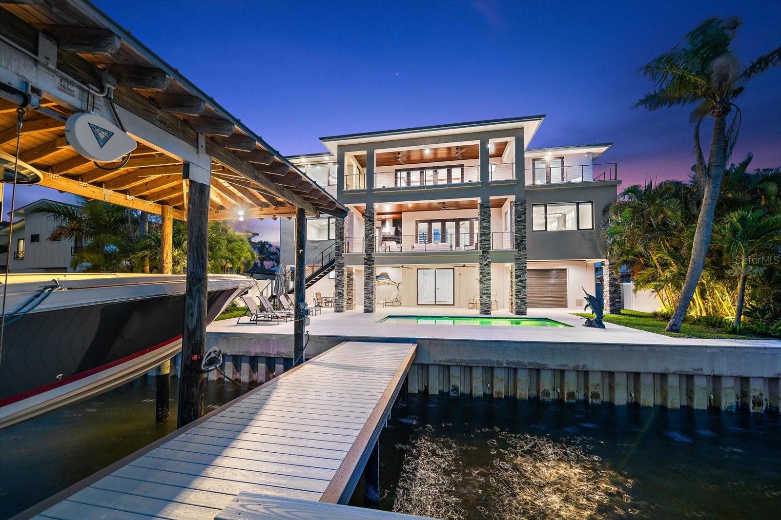 Impressive new seawall, dock, slip! Spectacular new residence-avoid the wait and challenges of building and live today in this spectacular property.