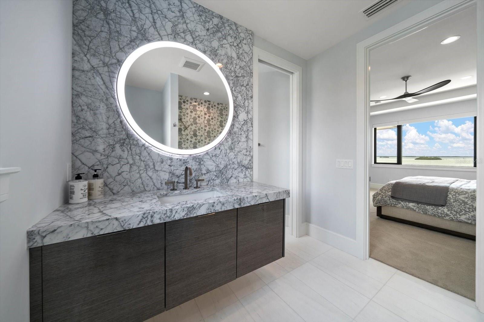Guest bath area servicing second level bedroom is sophisticated and refreshing!