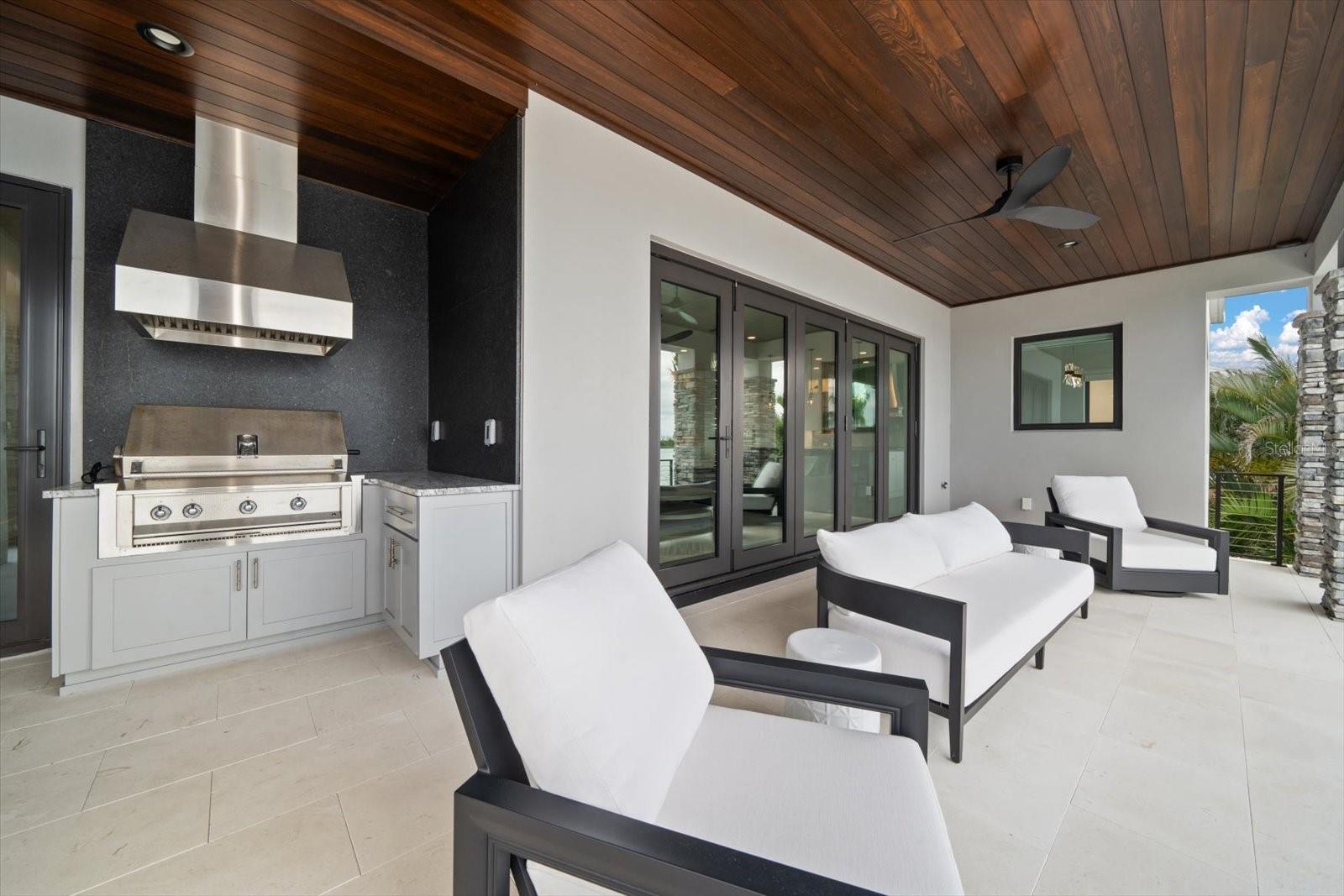 Outdoor kitchen area is steps to the kitchen-perfect set up for entertaining!